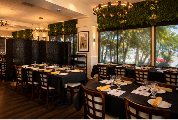 Wood chairs and black tablets in a private event room.